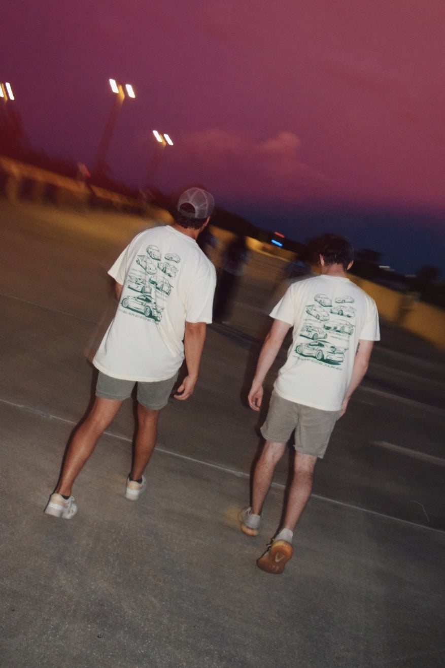 Male models wearing White 100% cotton t-shirt featuring green hand-drawn Porsche 911 GT3 RS designs with the text "Destroying Dailys The Pursuit of Perfection A Never Ending Journey," perfect for car enthusiasts.