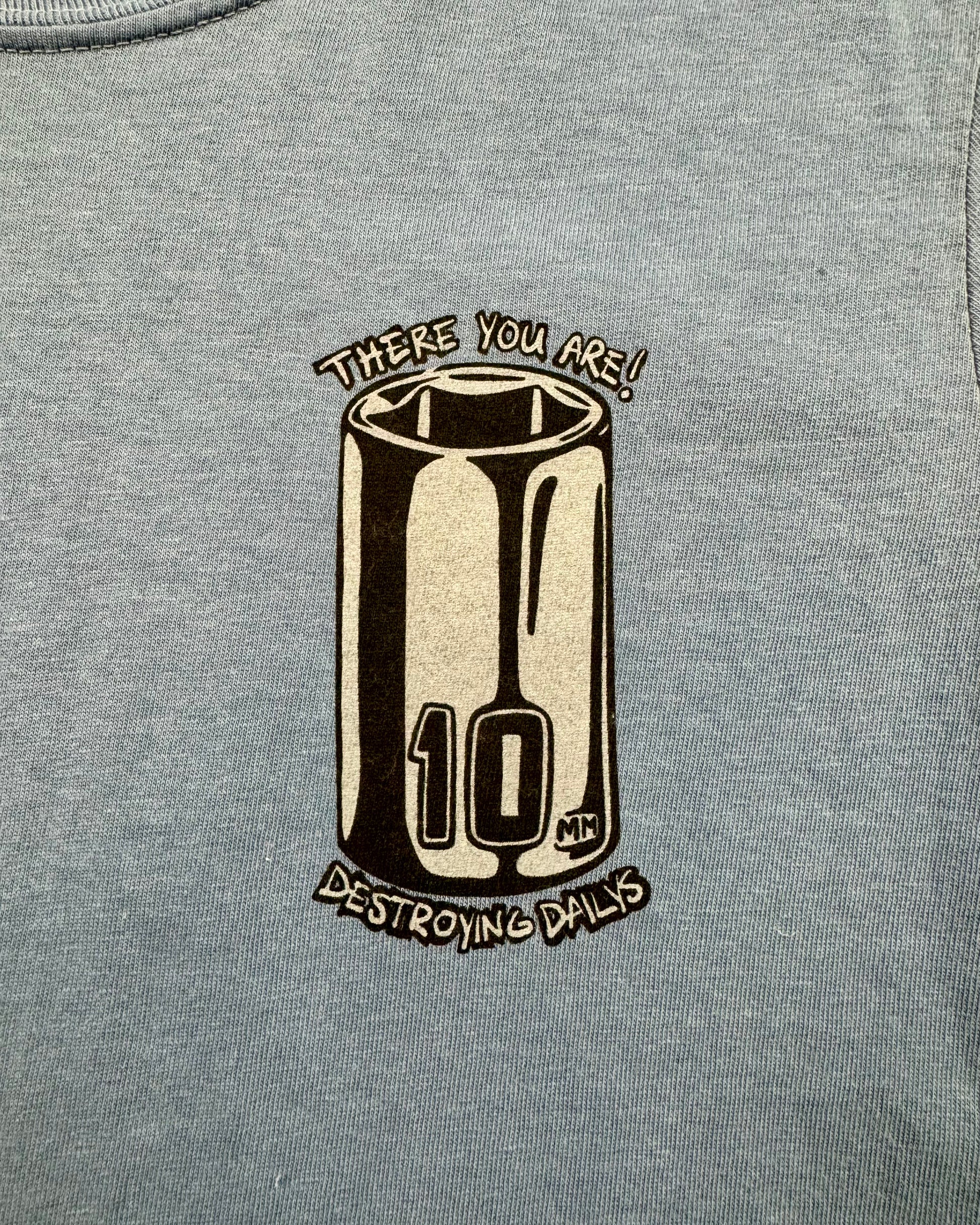 Car mechanic t shirt with a missing 10 Millimeter socket and a socket wrench. T shirt for car guys and car enthusiasts. 100% cotton tee shirt for car guys and car mechanics. Funny Mechanic Shirt with text "TF is my 10 mil?" on the back. Missing 10MM Socket T Shirt for mechanics. Detailed photo of the front logo featuring a 10MM socket on the front of a Tee shirt