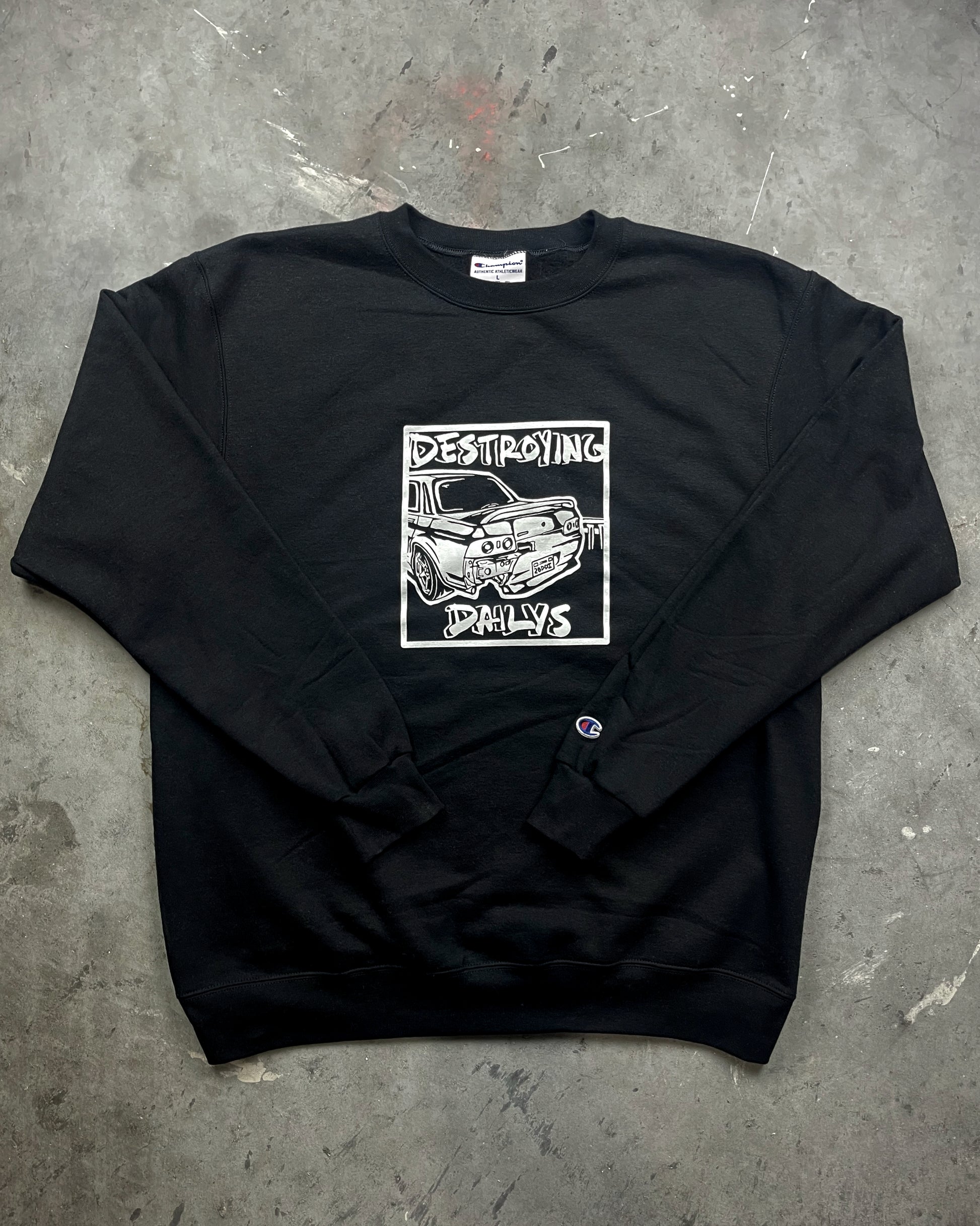 lifestyle photo of  Black crewneck sweatshirt made of 50/50 cotton and polyester blend featuring a hand-drawn JDM Skyline R32 with the text "Destroying Dailys," perfect for car enthusiasts. JDM sweatshirt for car guys, Nissan Skyline sweatshirt