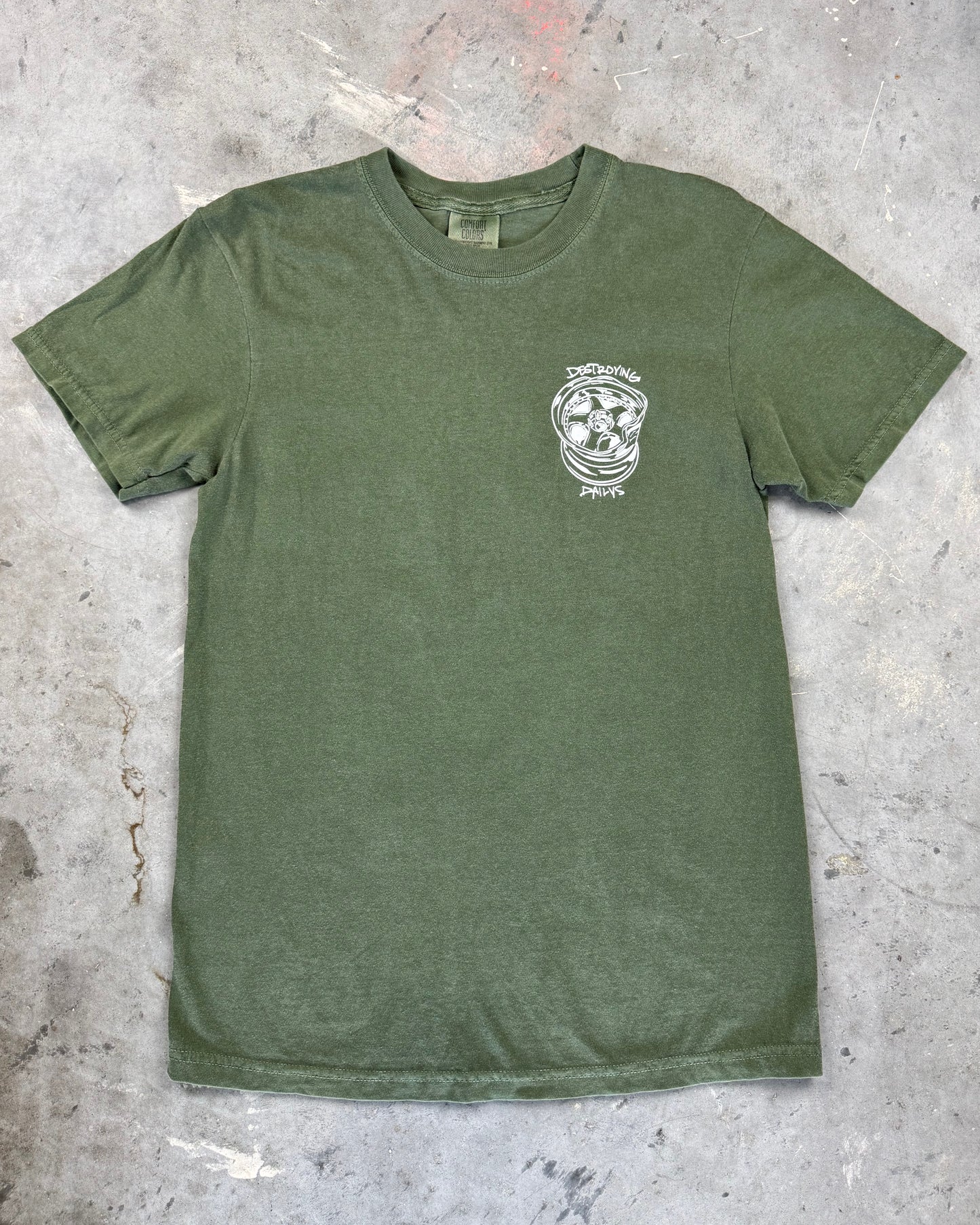 Green 100% cotton t-shirt featuring hand-drawn JDM wheels and the text "Destroying Dailys" on the back, perfect for JDM fans and car enthusiasts. Front of shirt with work wheels.