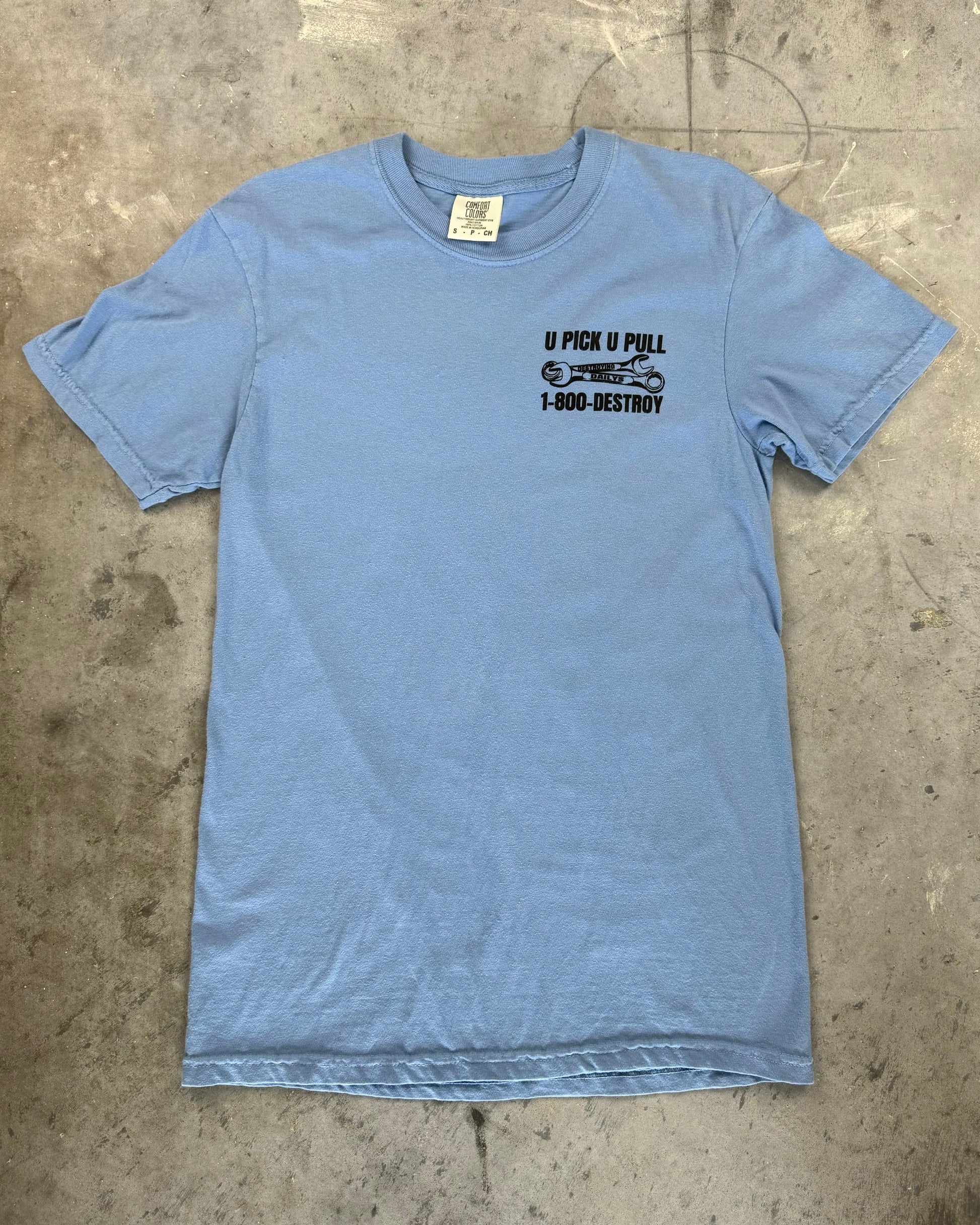 Light blue 100% cotton t-shirt with a small front graphic reading "U Pick U Pull 1-800-DESTROY," perfect for JDM car enthusiasts. JDM RX-7 On back of shirt