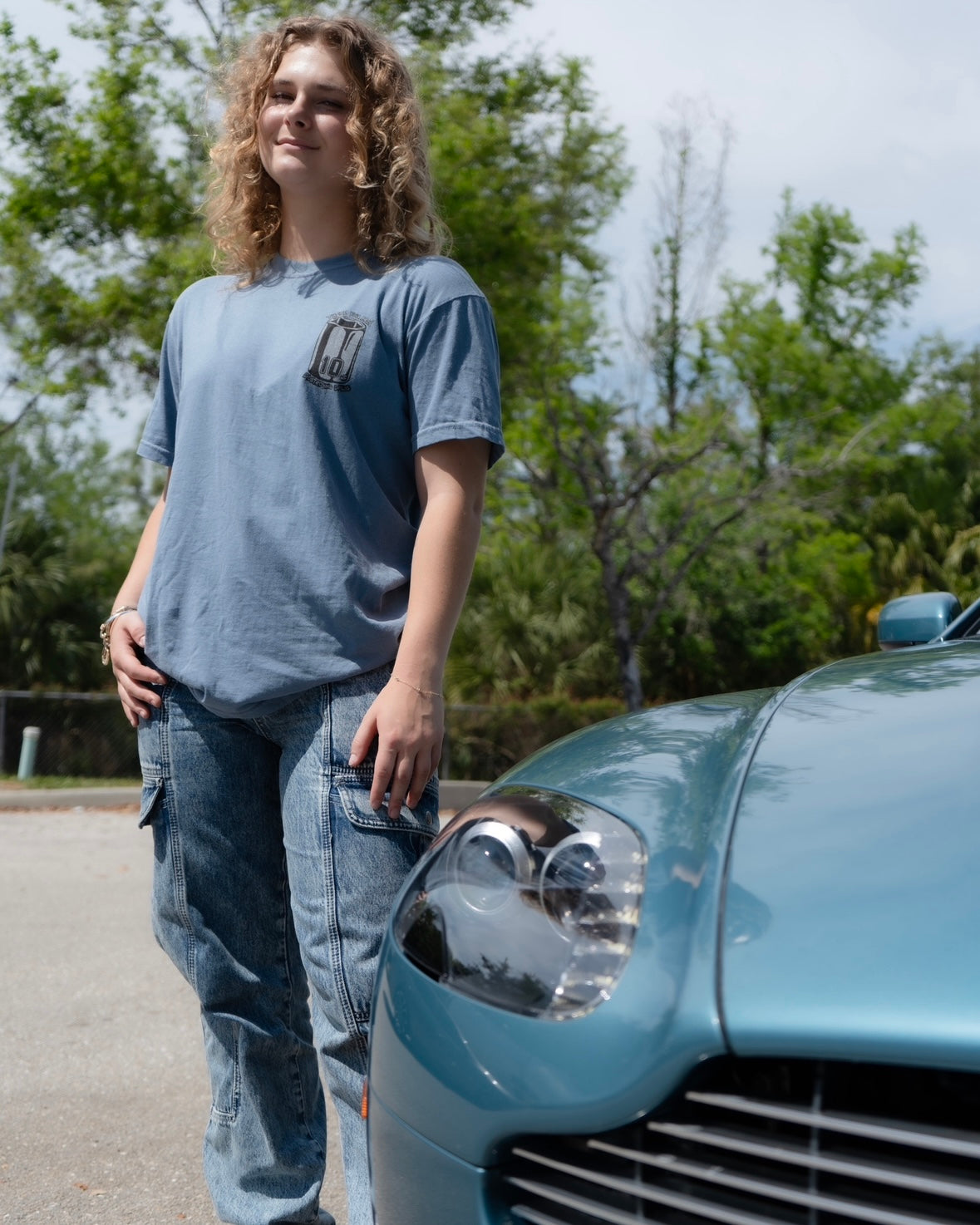 Car mechanic t shirt with a missing 10 Millimeter socket and a socket wrench. T shirt for car guys and car enthusiasts. 100% cotton tee shirt for car guys and car mechanics. Funny Mechanic Shirt with text "TF is my 10 mil?" on the back. Missing 10MM Socket T Shirt for mechanics. Model wearing the Shirt with front view shown