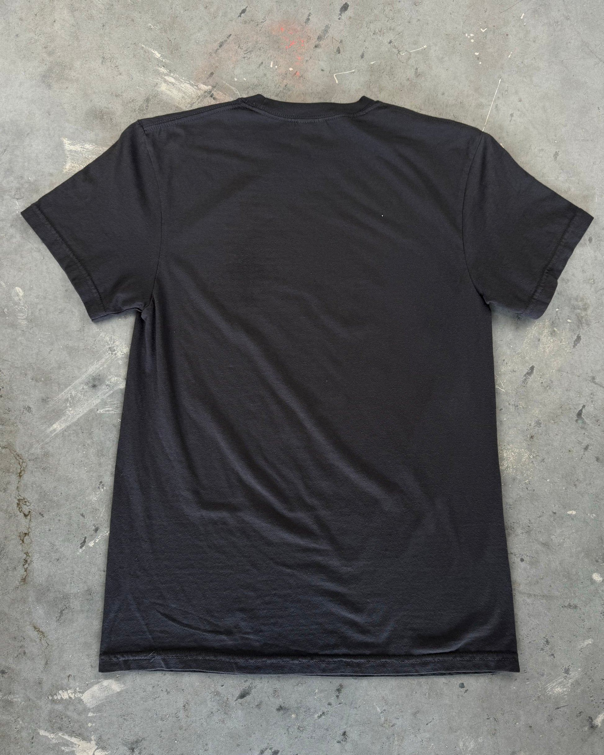 Black T-shirt featuring a hand-drawn design of a human ribcage made from various car parts. The design includes intricate details with text 'Destroying Dailys' incorporated into the ribs, appealing to car enthusiasts. Perfect for car fans, this T-shirt is made from soft 100% cotton, pre-shrunk, and garment dyed for a comfortable fit. Ideal for showcasing your passion for cars with a unique, artistic twist. Back of shirt