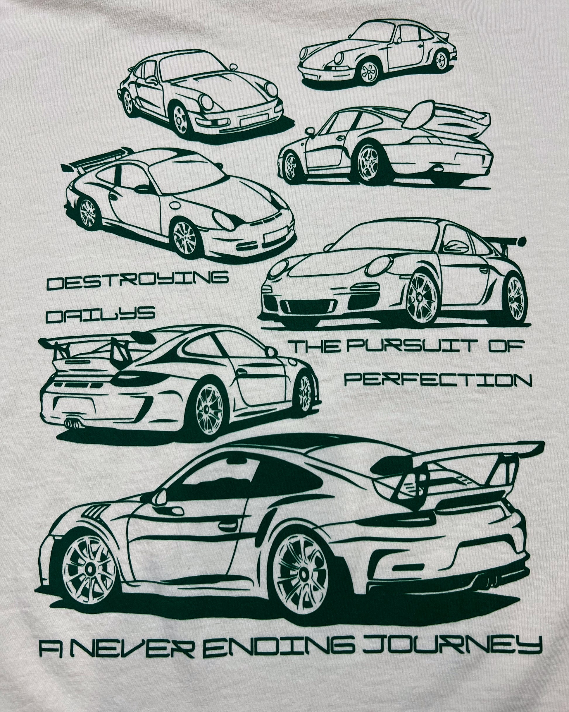 White 100% cotton t-shirt featuring green hand-drawn Porsche 911 GT3 RS designs with the text "Destroying Dailys The Pursuit of Perfection A Never Ending Journey," perfect for car enthusiasts. detailed photo of porsche 911 Tee design