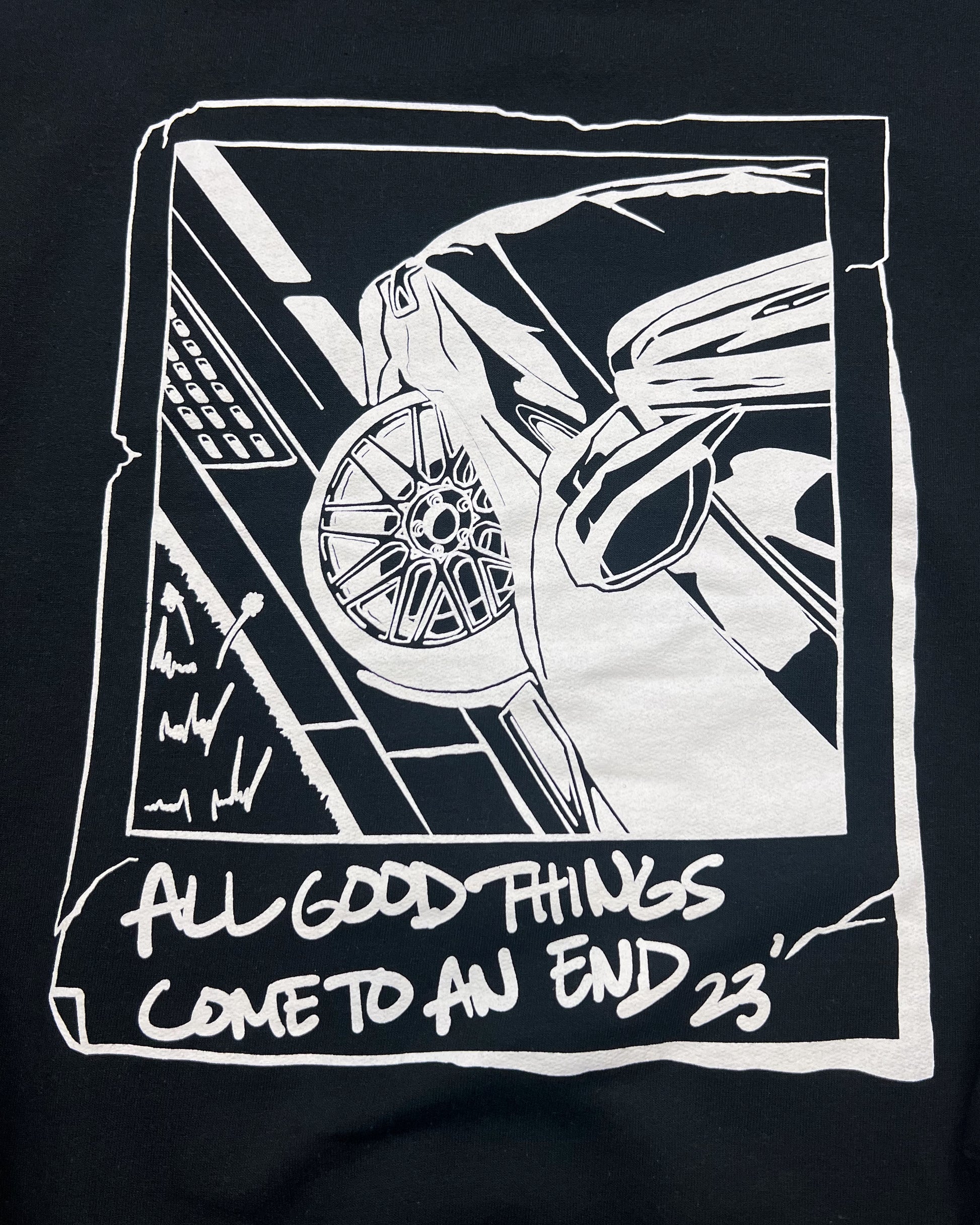 Close up photo of Black hoodie made of 50/50 cotton and polyester blend featuring a hand-drawn JDM car with the text "All Good Things Come to an End '23," perfect for car enthusiasts. Jdm hoodie for car guys