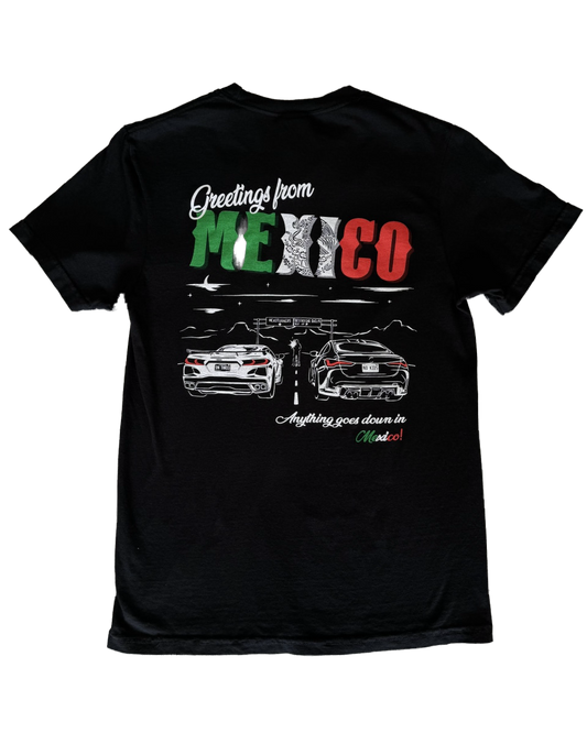 Black 100% cotton t-shirt featuring a hand-drawn Mexico racing scene with the text "Greetings from Mexico, Anything goes down in Mexico!" perfect for car enthusiasts. Mexico Racing T Shirt. Mexico racing corvette shirt. 