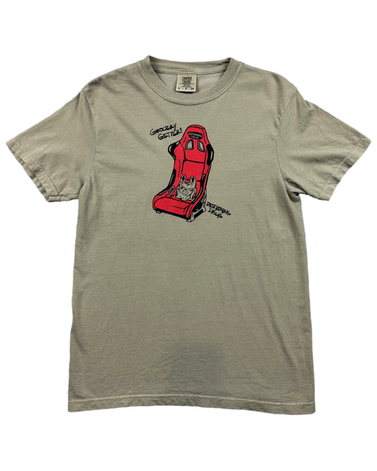 tan 100% cotton t-shirt featuring a hand-drawn red racing seat with a grocery bag and the text "Grocery Getter! Destroying Dailys," perfect for car enthusiasts. Funny car shirt for car enthusiasts